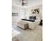 Bright bedroom with a ceiling fan, decorative rug, bench and neutral decor at 112 Village Ct, Woodstock, GA 30188