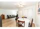 Open dining area next to a living room with ceiling fan and natural light from the window at 1325 Branch Dr, Tucker, GA 30084