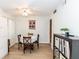 Cozy dining area with a table set for four, enhanced by natural light and a ceiling fan at 1325 Branch Dr, Tucker, GA 30084