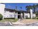 Exterior view of a well-maintained two-story apartment building with ample parking and manicured landscaping at 1325 Branch Dr, Tucker, GA 30084