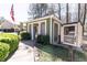 Community book exchange with seating near condos, surrounded by lush landscaping and mature trees at 1325 Branch Dr, Tucker, GA 30084
