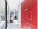 Bright hallway featuring tiled flooring, neutral walls and a vibrant red front door to welcome you home at 1325 Branch Dr, Tucker, GA 30084