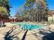 Enjoy a refreshing swim in this sparkling community pool surrounded by mature trees and lounge chairs at 1325 Branch Dr, Tucker, GA 30084