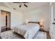 Bright bedroom featuring a walk-in closet, ceiling fan, and ample natural light at 390 17Th Nw St # 4031, Atlanta, GA 30363