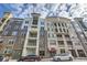 Attractive exterior view of a multi-story building with street access and visible entryways at 390 17Th Nw St # 4031, Atlanta, GA 30363