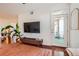 Cozy living room featuring a balcony with a chair and a modern entertainment center at 390 17Th Nw St # 4031, Atlanta, GA 30363