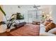 Inviting living room featuring a comfortable sofa, modern lighting, and a stylish rug at 390 17Th Nw St # 4031, Atlanta, GA 30363