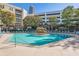 Inviting outdoor swimming pool surrounded by lounge chairs and mature trees at 390 17Th Nw St # 4031, Atlanta, GA 30363