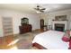 Bright bedroom featuring a ceiling fan, fireplace, and decorative furnishings at 584 Cherokee Ne St, Marietta, GA 30060