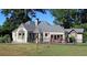 Charming single-story home with a manicured lawn and a classic iron fence surrounding the perimeter at 584 Cherokee Ne St, Marietta, GA 30060