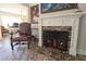 Close-up of a classic fireplace with a decorative screen and brick surround with custom wood mantle at 584 Cherokee Ne St, Marietta, GA 30060