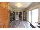 Light-filled hallway with hardwood flooring and beautiful built-in cabinets at 584 Cherokee Ne St, Marietta, GA 30060