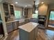 Beautiful kitchen featuring an island, stainless steel appliances, and lots of natural light at 584 Cherokee Ne St, Marietta, GA 30060