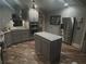 Modern kitchen featuring an island, stainless steel appliances, and hardwood floors at 584 Cherokee Ne St, Marietta, GA 30060
