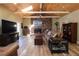 Cozy living room features a vaulted ceiling, brick fireplace, and hardwood floors at 584 Cherokee Ne St, Marietta, GA 30060