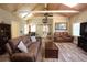 Inviting living room with hardwood floors and comfortable leather sofas, clock and artwork at 584 Cherokee Ne St, Marietta, GA 30060