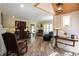 View of the living room, showcasing hardwood floors, furniture, lamps, and transom window at 584 Cherokee Ne St, Marietta, GA 30060