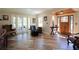 Open floor plan showing living room with hardwood flooring, and sitting area near a front door at 584 Cherokee Ne St, Marietta, GA 30060