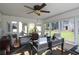 Bright office with a ceiling fan, many windows, and dark floors at 584 Cherokee Ne St, Marietta, GA 30060