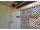 An outdoor shower features a lattice privacy screen, a brick wall, and a mounted shower head at 584 Cherokee Ne St, Marietta, GA 30060