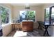 Bright sunroom featuring a small wooden island and view of the garden at 584 Cherokee Ne St, Marietta, GA 30060