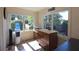 Cozy sunroom with a 'Cafe' sign, and views of the landscaped garden at 584 Cherokee Ne St, Marietta, GA 30060