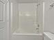 Bathroom featuring a full tub and shower with neutral walls at 68 Silverthorne Pass, Douglasville, GA 30134