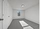Bedroom featuring neutral walls, carpeted floor, and a window allowing for lots of natural light at 68 Silverthorne Pass, Douglasville, GA 30134