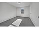 Bedroom featuring neutral walls, carpeted floor, and a window allowing for lots of natural light at 68 Silverthorne Pass, Douglasville, GA 30134