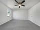 Spacious bedroom featuring neutral walls, carpeted floor, and a ceiling fan at 68 Silverthorne Pass, Douglasville, GA 30134