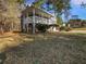 Charming two-story home featuring a covered porch, complemented by mature trees and a well-maintained lawn at 68 Silverthorne Pass, Douglasville, GA 30134