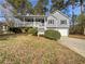 Charming two-story home with a inviting porch and well-manicured landscaping at 68 Silverthorne Pass, Douglasville, GA 30134