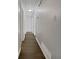 Hallway featuring neutral walls, contemporary recessed lighting, and wood flooring at 68 Silverthorne Pass, Douglasville, GA 30134