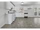 Bright kitchen features white cabinets, modern appliances, and easy access to dining at 68 Silverthorne Pass, Douglasville, GA 30134