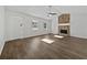 Bright living room featuring a stone fireplace, vaulted ceiling, and hardwood floors at 68 Silverthorne Pass, Douglasville, GA 30134