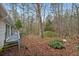 Backyard with deck, trees and foliage at 231 Holly Springs Ne Rd, White, GA 30184