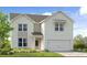 Charming two-story home with white siding, a two-car garage, and a welcoming front porch at 236 Groveton Ct, Euharlee, GA 30145