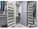 Organized walk-in closet with built-in shelving and ample storage space for clothes and accessories at 540 Woodall Ne Ave, Atlanta, GA 30306