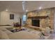 Finished basement featuring a stone fireplace, a cozy seating area, and a modern coffee table at 5430 Burdette Se Rd, Mableton, GA 30126