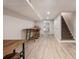 Basement area featuring a staircase, a laundry room and a long wooden table with stools at 5430 Burdette Se Rd, Mableton, GA 30126