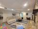 Finished basement featuring a stone fireplace, a cozy seating area, and a modern rug at 5430 Burdette Se Rd, Mableton, GA 30126