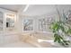 Bright bathroom features a soaking tub with artistic stained glass windows at 5430 Burdette Se Rd, Mableton, GA 30126