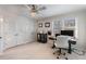Spacious bedroom showcasing large closet doors, natural light from the window, and a ceiling fan at 5430 Burdette Se Rd, Mableton, GA 30126