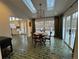 Breakfast nook featuring modern lighting, wooden table, and large sliding doors to the deck at 5430 Burdette Se Rd, Mableton, GA 30126