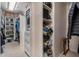 Organized walk-in closet with shelving, drawers and clothes racks at 5430 Burdette Se Rd, Mableton, GA 30126