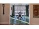 This dining room has a decorative light fixture, green tile flooring, and backyard views at 5430 Burdette Se Rd, Mableton, GA 30126