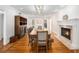 Elegant dining room featuring wood floors, a fireplace, and classic decor at 5430 Burdette Se Rd, Mableton, GA 30126