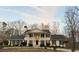 Elegant home with a welcoming entrance and classic design, nestled among mature trees creating a private retreat at 5430 Burdette Se Rd, Mableton, GA 30126