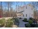 Charming two-story garage with beautifully landscaped walkway surrounded by lush greenery at 5430 Burdette Se Rd, Mableton, GA 30126