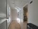 Bright hallway with tile floors, French doors, and easy access to other parts of the home at 5430 Burdette Se Rd, Mableton, GA 30126